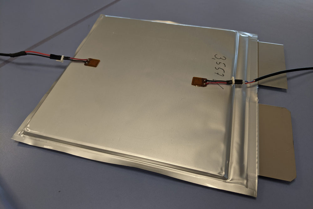 View of a battery cell with piezoelectric sensors for monitoring the state-of-charge.